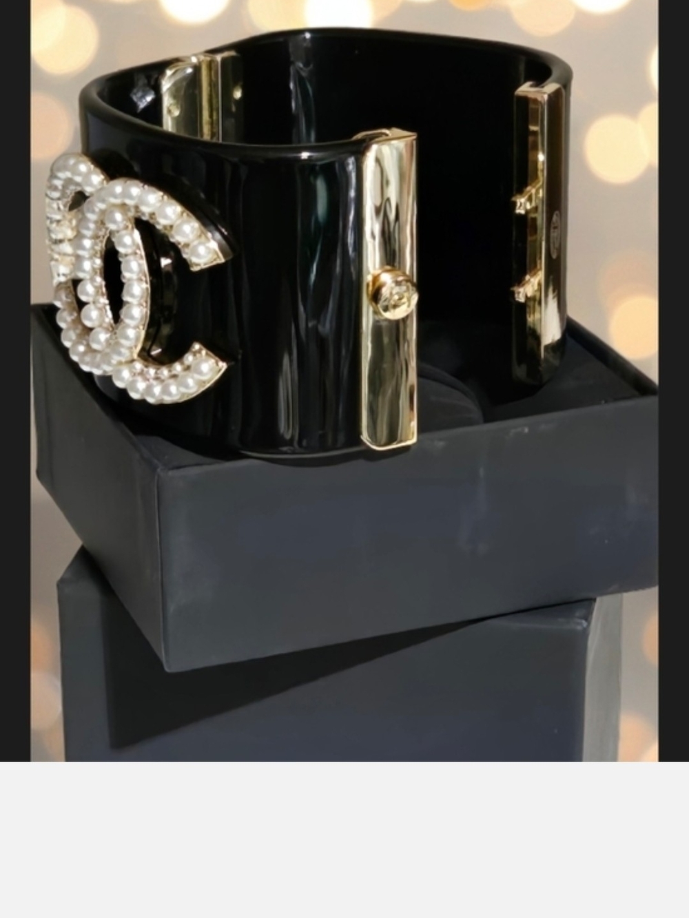 Luxury Black Resin Cuff Bracelet with Pearl Double-Loop Emblem and Gold Accents